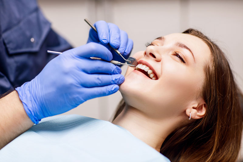 Dental Implant Patient At A Cleaning Appointment
