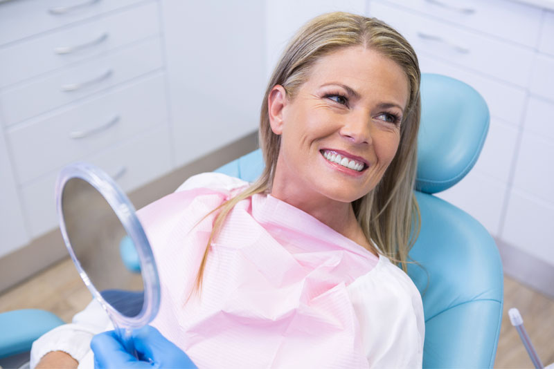 Dental Implant Patient Smiling After Her Procedure
