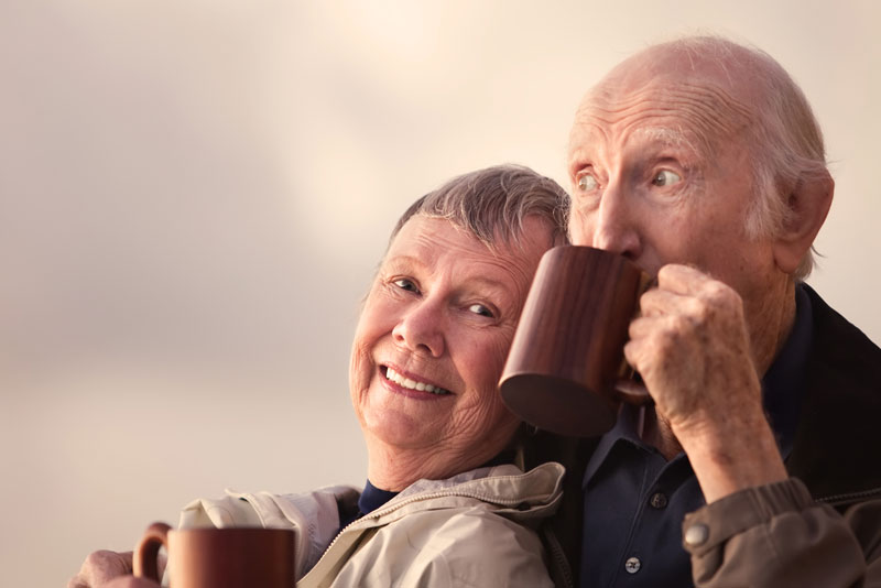 Dental Implant Patients Smiling Together While Drinking Coffee